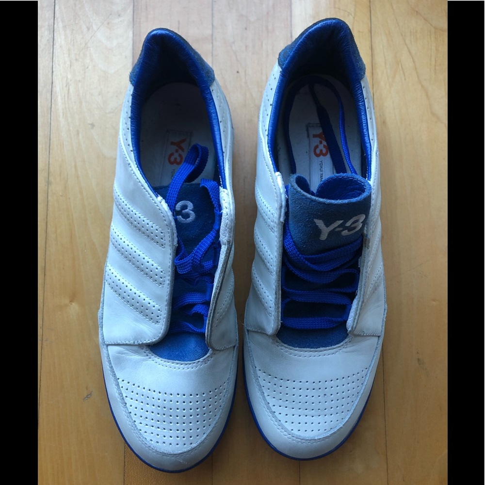 Y-3 white and blue sneakers.